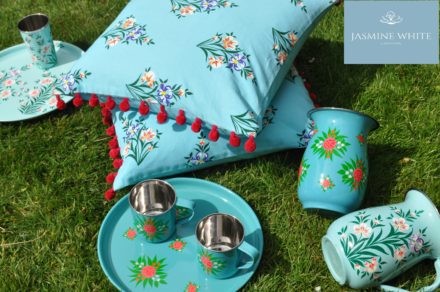 Jasmine White London hand painted Alice enamelware round tray, mugs and jug, with Diana jug and cushions